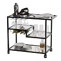 Stylish Black Serving Cart With Glass Shelves Plates Glasses And Magazine