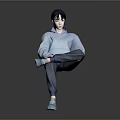 A Man in Blue Hoodie Blue Pants and Blue Shoes Sitting Cross-Legged Against Gray Background