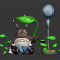 Brown Totoro Holding Small Blue Creature With Green Leaves And White Pole