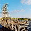 Garden Landscape With Bamboo Sculpture Floating on Water and Sky Reflections