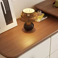 Dresser with White Drawers Wooden Top Table Lamp Green Plant and Chair with Gray Blanket