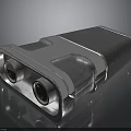 Metallic Rectangular Device With Dual Circular Components And Reflective Silver Surface