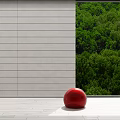Gray Linen Roman Blinds With Green Forest View And Red Sphere