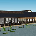 Traditional Style Commercial Complex With Black Roof Large Glass Windows And Water Pond Lotus Leaves