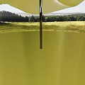 Garden Landscape With White Shade Sail Green Grass Trees And Distant Hills