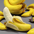 Fresh Ripe Yellow Banana Bunches With a Peeled One on Gray Background