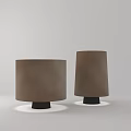 Two Brown Cylindrical Table Lamps with Black Base and Lighting Effect on White Background 3d model