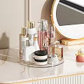 Elegant Modern Perfume And Cosmetics On Marble Counter With Transparent Rotating Organizer Round Mirror