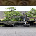 Serene Garden Ornament Design With Trees Green Plants Stones Water Fountain And Paved Floor