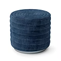 Dark Blue Round Ottoman With Concentric Striped Design And Upholstered Fabric