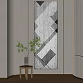 Geometric Pattern Wall Art With Green Plant On Small Wooden Table In Interior