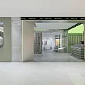 Contemporary Clothing Store Interior With Glass Doors Display Racks Green Walls And Bright Lighting