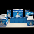 Display Shelves With Blue Tablecloth Product Boxes And Background Advertising Boards