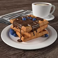 Waffles With Chocolate Sauce Blueberries On White Plate Coffee And Cutlery On Napkin Wooden Table