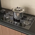 Kitchen Cookware Setup With Stainless Steel Pot On Black Gas Stove And Wooden Cabinets