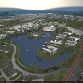 Modern Industrial Factory Complex With Central Water Area And Surrounding Green Spaces