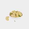 White ceramic bowl filled with fresh ripe mangoes and green leaves