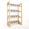 Decorative Wooden Shelf With Multiple Layers Holding Silver And Gold Spheres