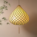 Bamboo Woven Teardrop Shaped Lantern With Warm Yellow Light And Bamboo Leaves