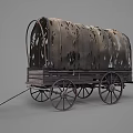 Vintage Covered Wagon With Tattered Canvas Top And Wooden Wheels