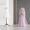 Elegant Designer White Lace And Purple Tulle Dresses On Mannequins In Modern Studio