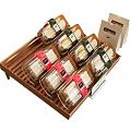 Bottled Food Items in Transparent Bottles on Bamboo Tray With Colored Labels