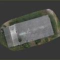 Old Building Model With Gray Roof Broken Windows And Green Grass Plants