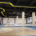 Modern Indoor Basketball Court With Hexagonal Ceiling Lights And Court Markings