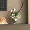White Flowers Arrangement in Ceramic Vase with Globe Lamp and Books on Shelf Home Decor