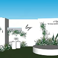 Outdoor Wedding Decor With White Wall Logo Greenery Flowers Round Platform Grass And Blue Sky