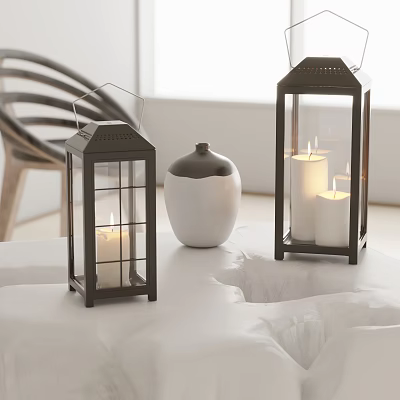 Decorative Black Candle Lanterns With Lit Candles On White Table And Black White Vase 3d model