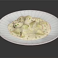 Creamy White Ravioli in Rich Sauce Garnished with Fresh Green Herbs on White Plate