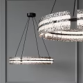 Modern Circular Chandelier With Textured Glass Rings And Black Metal Hanging In Interior