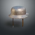 Antique Military Helmet With Worn Metallic Surface And Historical Protective Design
