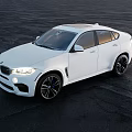 White BMW SUV Coupe With Sleek Exterior Design Parked On Black Asphalt