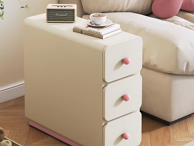 Beige Storage Cabinet With Three Drawers Pink Handles And Radio Book Coffee Cup On Top 3d model