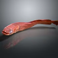 Red Decorative Fish Figurine With Shiny Surface And Dark Background Reflection