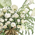 Elegant Floral and Greenery Decorative Arrangement with White Flowers Large Tropical Leaves and Brown Spikes