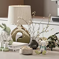 Green Rabbit And Elephant Dolls On Decorative Table With Lamp Vase Branches Books Motorcycle Model