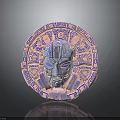 Circular Decorative Ornament In Pink Blue With Intricate Face Carving And Geometric Patterns