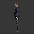 Man In Dark Blue Sweater Dark Pants And Black Shoes Standing On Gray Background