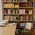 Wooden Bookcase In Home Study With Shelves Filled With Books And Decorative Items
