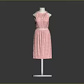 Man Modeling Pink Polka Dot Halter Dress on White Mannequin Stand