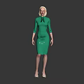 Blonde Woman in Fitted Green Dress with Tie Detail Against Dark Background Wearing High Heels