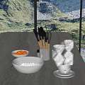 Modern Kitchen Countertop With Black Salt Bowl Wooden Handle Utensils And Golden Measuring Cups