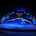 Stunning Star Avenue Stage Design with Blue Lighting Steps Large Screens and Silhouettes
