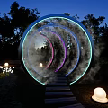 Nighttime Photo Check-in Spot Featuring Circular Glowing Rings Smoke Pathway And Spherical Lights