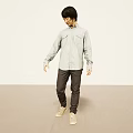 Man In Light Gray Shirt Dark Gray Pants Beige Sneakers In Minimal Space