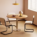 Round Wooden Dining Table With Three Chairs White Seats Black Frames Yellow Lamp And Fruits