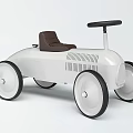 White Electric Toy Car With Brown Seat And Big Wheels